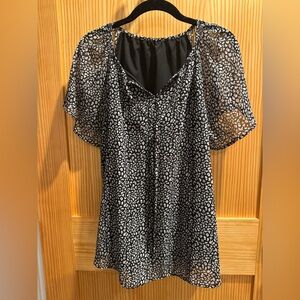 Flowy black and white blouse.